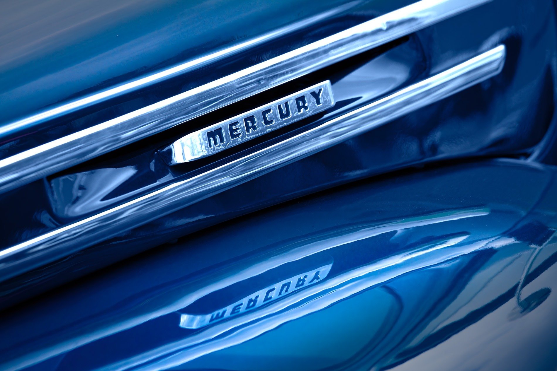 Mercury Badge and Reflection