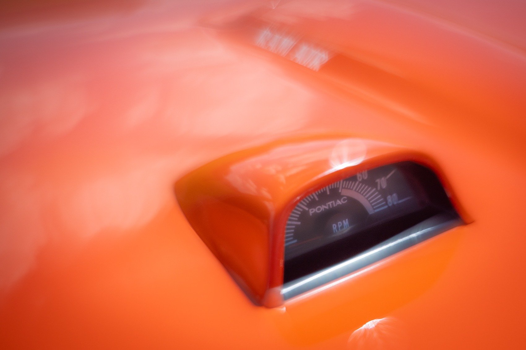 Orange Pontiac / Hood-mounted tachometer / Measures engine revs
