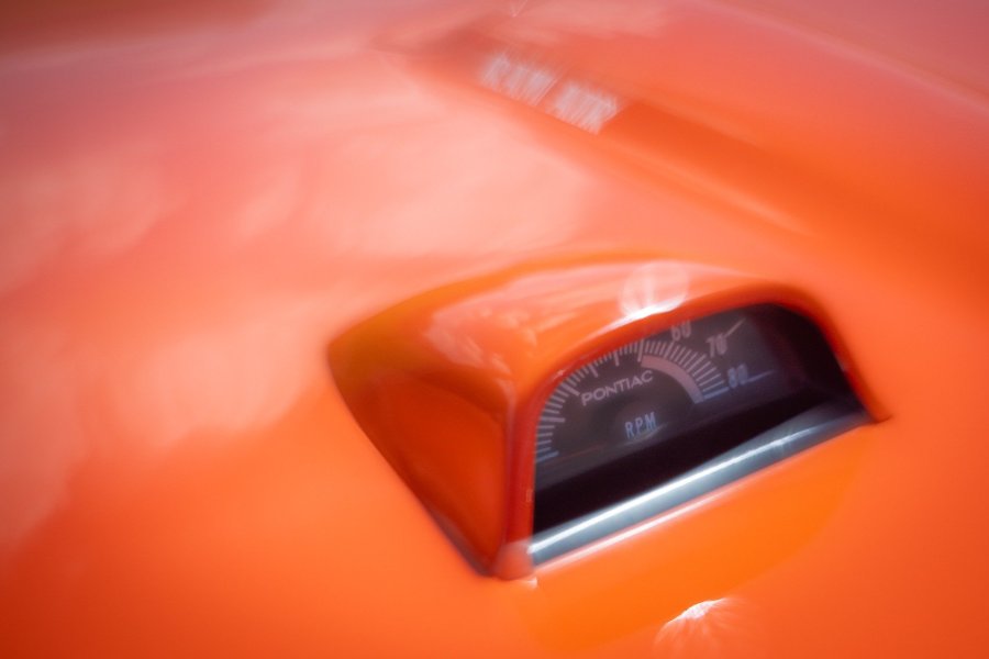 Orange Pontiac / Hood-mounted tachometer / Measures engine revs