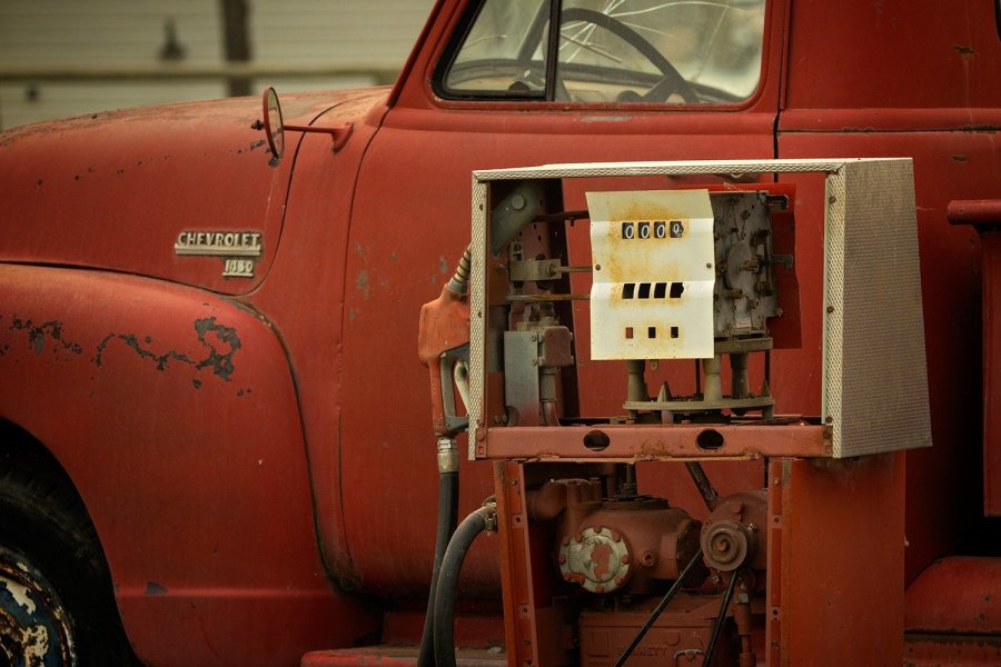 Red Chevrolet Truck and Vintage Gas Pump