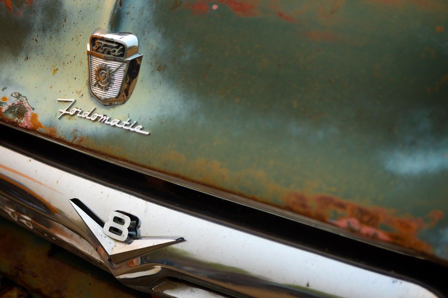 Vintage Fordomatic Badges on Rusty Ford